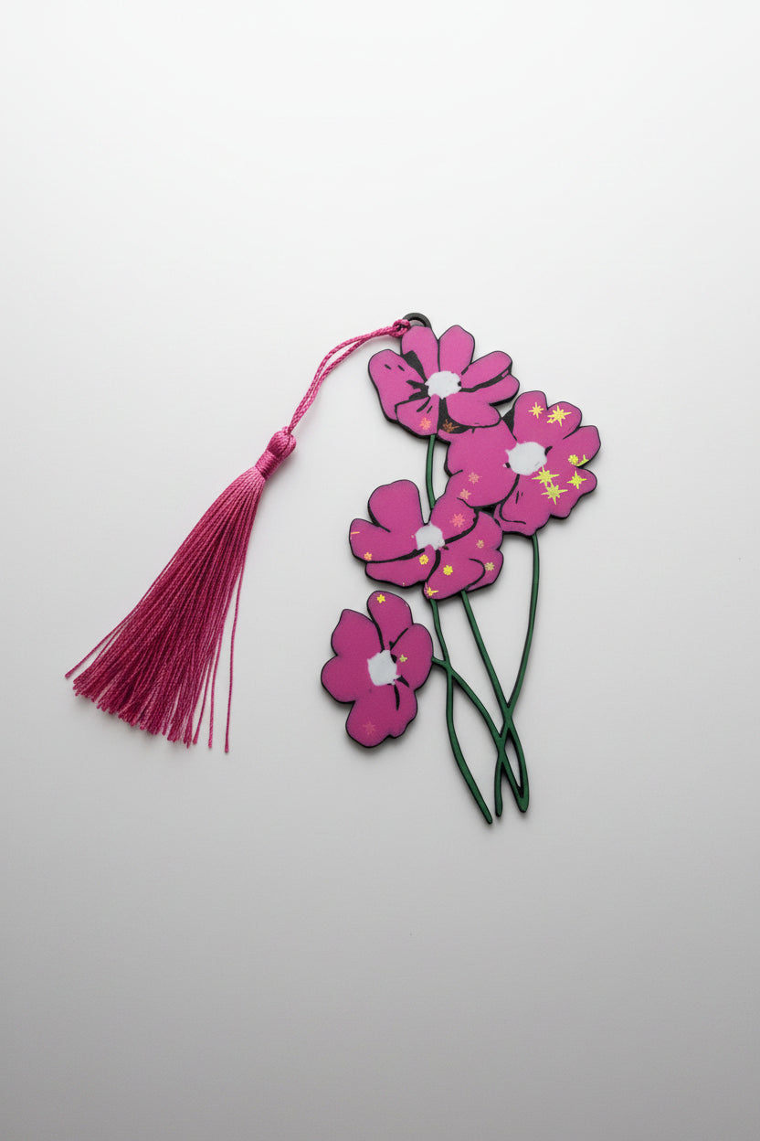 Floral pink bookmark with long green stems with tassel on a light gray background