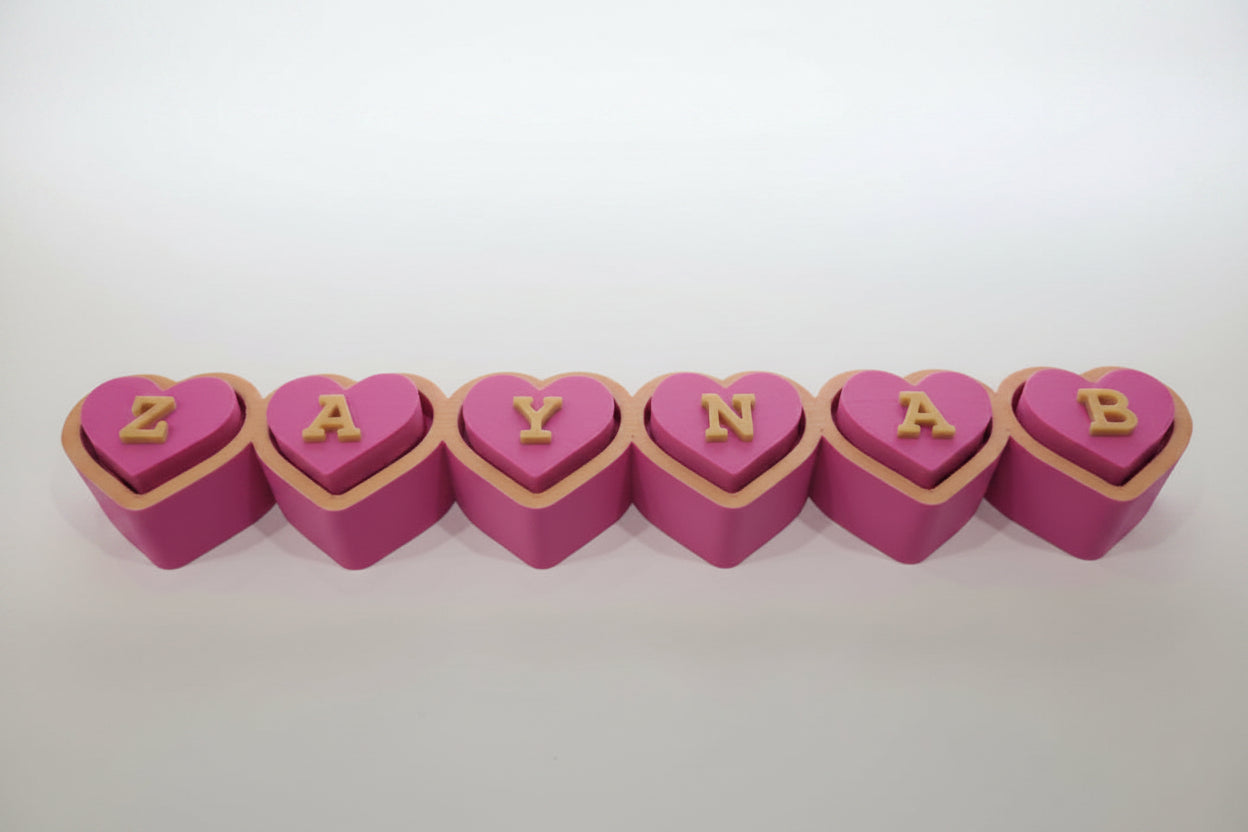 Personalized heart clicker with custom name in gold letters — biodegradable PLA desk fidget by Aurelis Design Studio