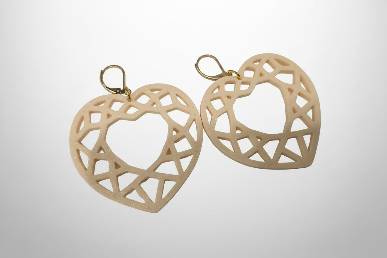 Geometric Heart Earrings flat lay — lightweight eco-friendly PLA statement earrings in cream by Aurelis Design Studio
