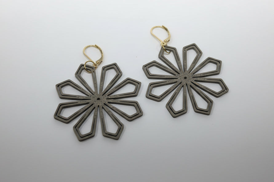 Close-up of bronze Geometric Flower Earrings showing eco-friendly PLA material and geometric detail by Aurelis Design Studio
