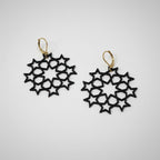 Close-up of Star Cluster Earrings showing biodegradable PLA material and star detail in black color by Aurelis Design Studio