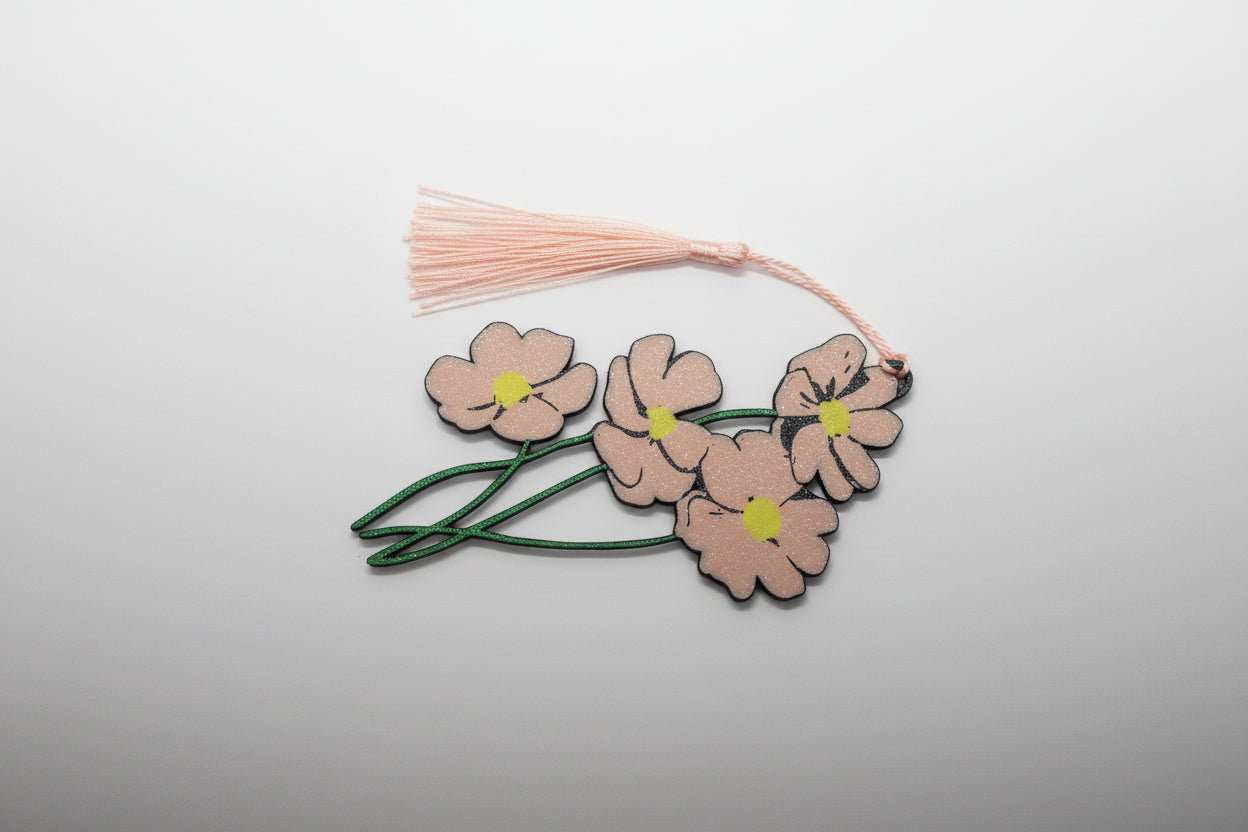 Peach Floral with green stems bookmark with tassel on a white background