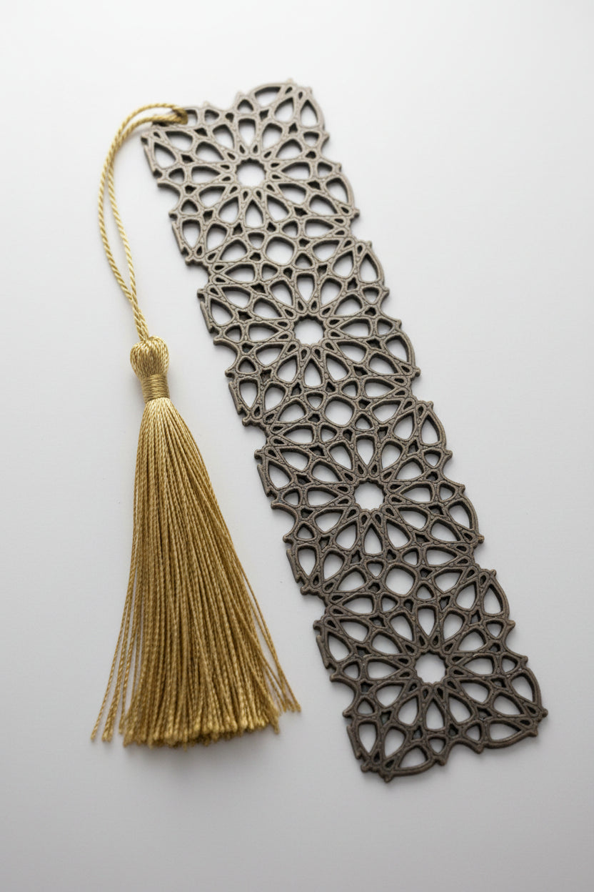 Decorative 3D printed bookmark with intricate patterns and a tassel 