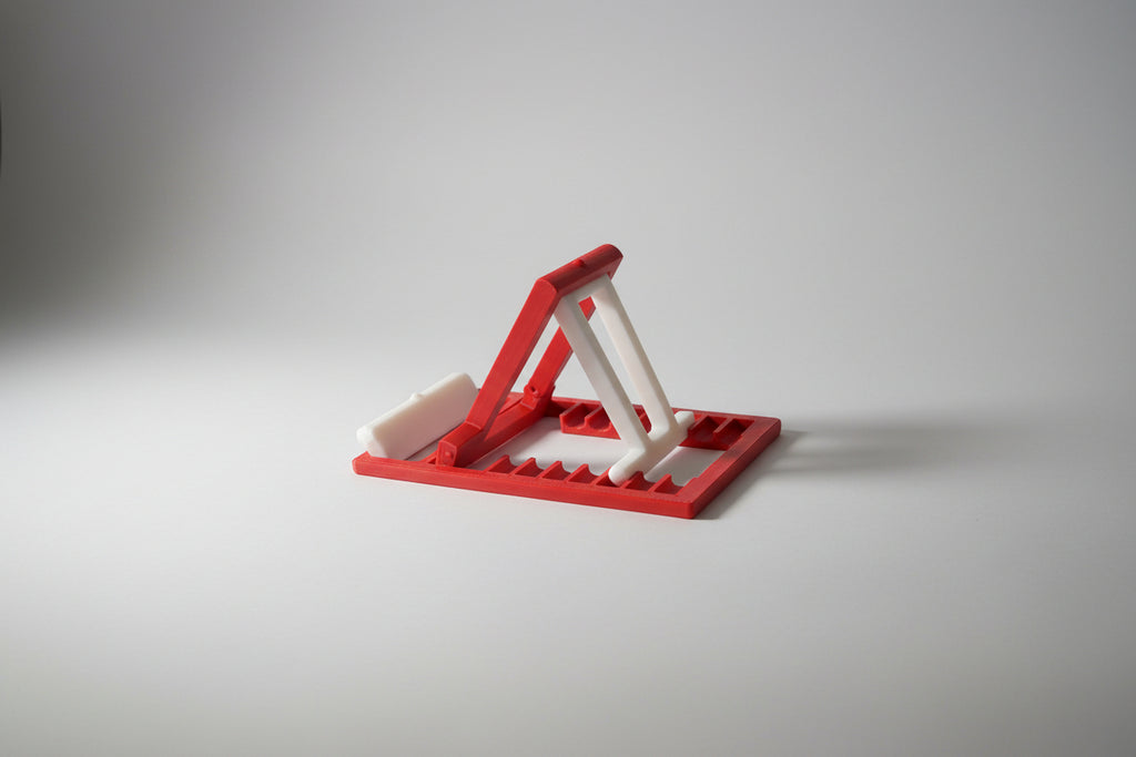 Red and white phone stand representing Canada Colors