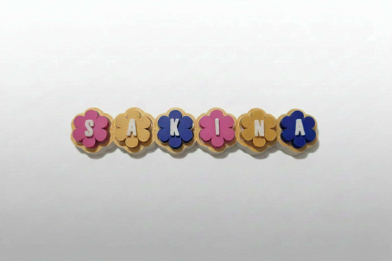 Candy-coloured personalized flower clicker in biodegradable PLA – custom name fidget toy
