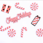 Custom 3D printed pieces by Aurelis Design Studio of Christmas elements including candy canes, peppermints, and a 'Happy Holidays' sign on a white background.
