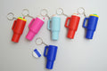 Colorful keychains shaped like stanley cups on a white background