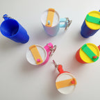 Colorful stanley cup keychain on a white background