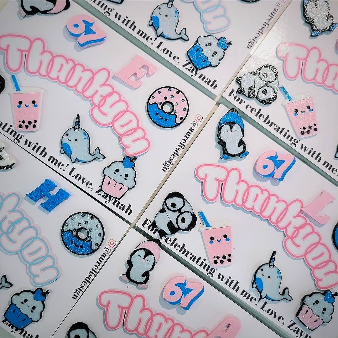 sheets with pins of cute characters and 'Thankyou' text, arranged in a gridby Aurelis Design Studio